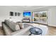 Spacious living room with sectional sofa, large TV, and water views at 4910 Green Dolphin Way, Kiawah Island, SC 29455