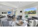 Open living area with sectional sofa, dining area and water views at 4910 Green Dolphin Way, Kiawah Island, SC 29455