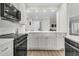 Modern kitchen with island and view to living area at 4910 Green Dolphin Way, Kiawah Island, SC 29455