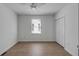 Charming bedroom with hardwood floors, a ceiling fan, and closet at 207 W Poplar St, Charleston, SC 29403