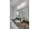 Elegant bathroom with granite countertop and a large mirror at 207 W Poplar St, Charleston, SC 29403