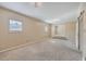 Spacious bedroom with neutral carpet and barn door at 1090 Peru Rd, Saint Stephen, SC 29479