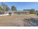 Brick ranch house with attached garage, covered porch, and landscaped yard at 1090 Peru Rd, Saint Stephen, SC 29479