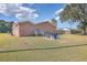 Brick house with a large backyard, featuring a fire pit and shed at 1090 Peru Rd, Saint Stephen, SC 29479