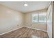 Bright bedroom with wood flooring and sliding barn door at 1090 Peru Rd, Saint Stephen, SC 29479