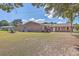 Brick house with a large backyard, featuring a fire pit and shed at 1090 Peru Rd, Saint Stephen, SC 29479