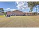 Brick house with a large backyard, featuring a fire pit and shed at 1090 Peru Rd, Saint Stephen, SC 29479