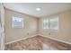 Well-lit bedroom with wood flooring and neutral wall colors at 1090 Peru Rd, Saint Stephen, SC 29479