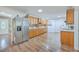 Kitchen boasts wood cabinets, stainless steel appliances, and a tile backsplash at 1090 Peru Rd, Saint Stephen, SC 29479