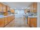 Bright kitchen with ample wood cabinets, stainless steel appliances, and tile flooring at 1090 Peru Rd, Saint Stephen, SC 29479