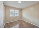 Simple bedroom with wood flooring and a window at 1090 Peru Rd, Saint Stephen, SC 29479