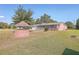 Brick ranch house with attached garage and brick well in the front yard at 1090 Peru Rd, Saint Stephen, SC 29479