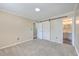 Bright bedroom featuring a barn door and access to bathroom at 1090 Peru Rd, Saint Stephen, SC 29479