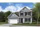 Two-story house with a blue exterior and black shutters at 4 Wappoo Trace Ln, Summerville, SC 29486