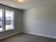 Simple bedroom with large window and neutral wall color at 11 Tidewater Ln, Summerville, SC 29486