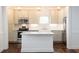 Modern kitchen with white cabinets and marble island at 59 Ashe St, Charleston, SC 29403
