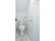 Small powder room with hexagon tile floor and white wainscoting at 59 Ashe St, Charleston, SC 29403