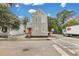 Two-story home with a grey exterior, red roof, and charming front steps at 59 Ashe St, Charleston, SC 29403