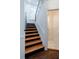 Staircase with dark wood steps and white painted risers at 59 Ashe St, Charleston, SC 29403