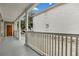 Inviting front porch with white columns and grey flooring at 59 Ashe St, Charleston, SC 29403