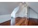 Spacious attic room with wood floors and access to other rooms at 59 Ashe St, Charleston, SC 29403