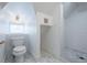Modern bathroom with white tile shower and hexagon floor tile at 59 Ashe St, Charleston, SC 29403