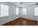 Well-lit bedroom featuring hardwood floors and updated window treatments at 59 Ashe St, Charleston, SC 29403