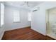 Bright bedroom with hardwood floors, updated window treatments, and en-suite bathroom access at 59 Ashe St, Charleston, SC 29403