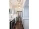 Modern kitchen with stainless steel appliances and dark hardwood floors at 59 Ashe St, Charleston, SC 29403