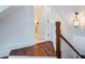 Upper hallway with wood floors, leading to bathroom and additional rooms at 59 Ashe St, Charleston, SC 29403
