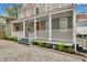 Renovated home with front porch and cobblestone driveway at 59 Ashe St, Charleston, SC 29403