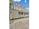 Two-story home with a grey exterior, red roof, and front porch at 59 Ashe St, Charleston, SC 29403