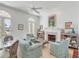 Bright living room with fireplace and French doors leading to a balcony at 106 W Shipyard Rd, Mount Pleasant, SC 29464