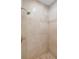 Large shower with beige marble tiles and a modern shower fixture at 106 W Shipyard Rd, Mount Pleasant, SC 29464