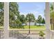 Lovely view of the water and lush landscaping from the porch at 106 W Shipyard Rd, Mount Pleasant, SC 29464