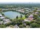 Aerial view of a neighborhood with houses surrounding a pond at 106 W Shipyard Rd, Mount Pleasant, SC 29464