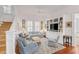 Bright Gathering room with built-in shelving, comfortable seating, and hardwood floors at 106 W Shipyard Rd, Mount Pleasant, SC 29464