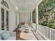 Spacious porch with outdoor seating and tranquil garden views at 106 W Shipyard Rd, Mount Pleasant, SC 29464