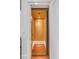 Private home elevator with wood floors and light wood paneling at 106 W Shipyard Rd, Mount Pleasant, SC 29464