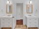 Double vanity bathroom with marble countertops and white cabinets at 106 W Shipyard Rd, Mount Pleasant, SC 29464
