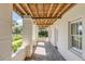 Covered porch with stone flooring and wooden beams at 106 W Shipyard Rd, Mount Pleasant, SC 29464