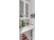 Wet bar with glass-front cabinets, wine cooler, and marble countertop at 106 W Shipyard Rd, Mount Pleasant, SC 29464