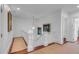Elegant hallway with hardwood floors and a stunning staircase at 106 W Shipyard Rd, Mount Pleasant, SC 29464
