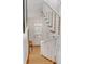 Elegant staircase with white railings and light brown carpeting at 106 W Shipyard Rd, Mount Pleasant, SC 29464
