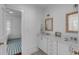 Bright bathroom with double vanity, and a view of a bedroom at 106 W Shipyard Rd, Mount Pleasant, SC 29464