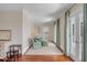 Light-filled sitting area with two armchairs and access to a private balcony at 106 W Shipyard Rd, Mount Pleasant, SC 29464