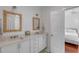 White bathroom with double vanity and a view of a bedroom at 106 W Shipyard Rd, Mount Pleasant, SC 29464