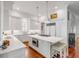 Spacious kitchen featuring white cabinetry, marble countertops, and a large island at 106 W Shipyard Rd, Mount Pleasant, SC 29464