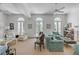 Spacious living room with light-colored furniture, arched French doors, and neutral tones at 106 W Shipyard Rd, Mount Pleasant, SC 29464