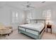Bedroom with king-size bed, ceiling fan and a comfortable armchair at 106 W Shipyard Rd, Mount Pleasant, SC 29464